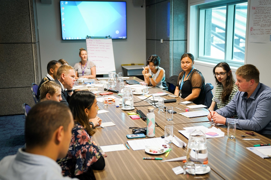 Members of the 2021 Youth Advisory Group discuss issues in education with Minister Hipkins at an official meeting.