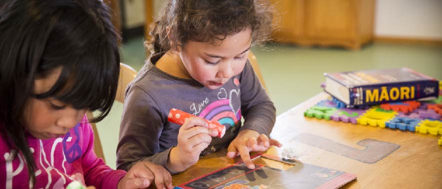 Two children playiing in an early learning environment